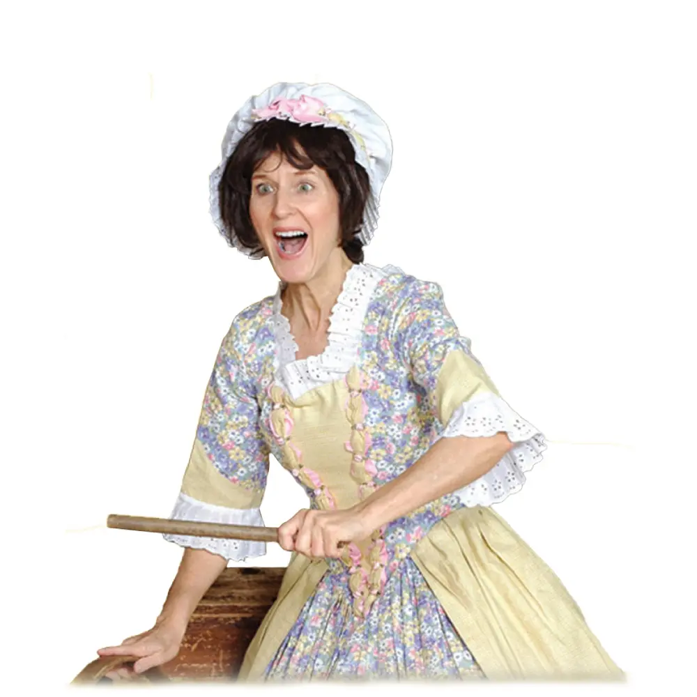 A woman in an old fashioned dress holding a knife.
